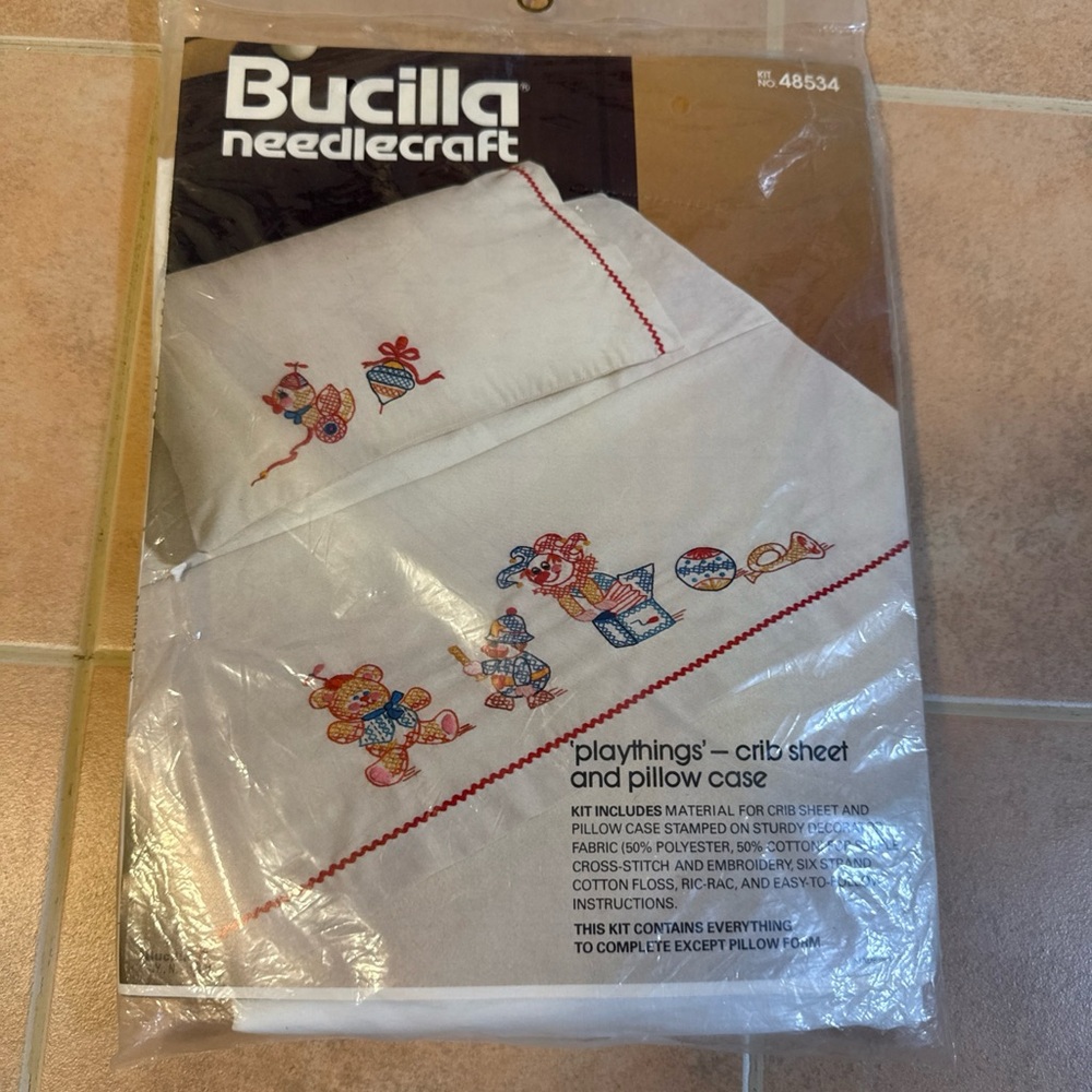 Bucilla Needlecraft Crib Sheet and Pillow Case - White with Red and Blue Accents